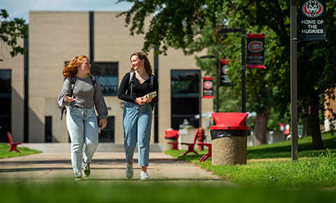 Students walk outside through SCSU's campus