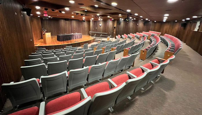 Atwood Memorial Center theater with the lights on and empty chairs