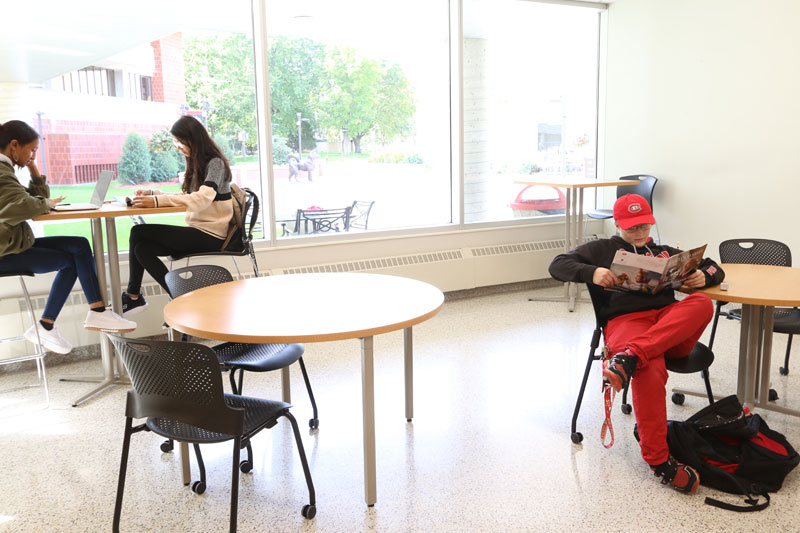 West Entrance Lounge of Atwood Memorial Center featuring seating near windows for students to unwind or study