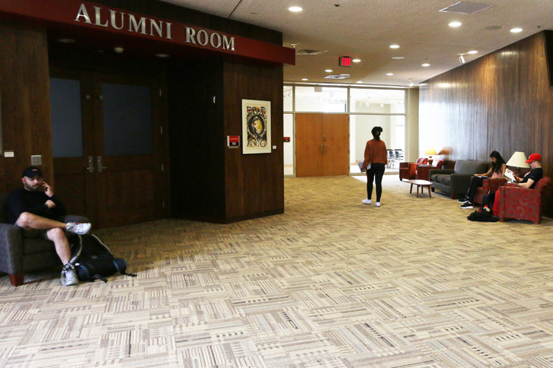 Theatre Lounge in Atwood Memorial Center showing students sitting on chairs relaxing near the entrance to the Alumni Room
