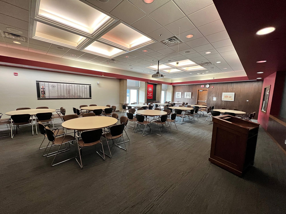 Interior view of the Alumni Room at Atwood Memorial Center highlighting seating arrangement and presentation area for meetings or events