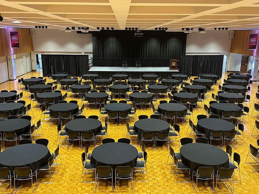Tables and chairs set up for an event in the Atwood Memorial Center Ballroom
