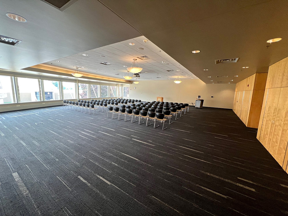 Interior of the Cascade Room at Atwood Memorial Center showing a meeting space with tables and chairs arranged for a group