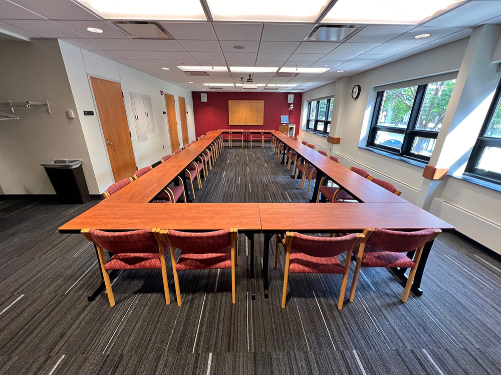 Interior of the Mississippi Room at Atwood Memorial Center showing tables and chairs arranged in a rectangular setup with windows providing natural light
