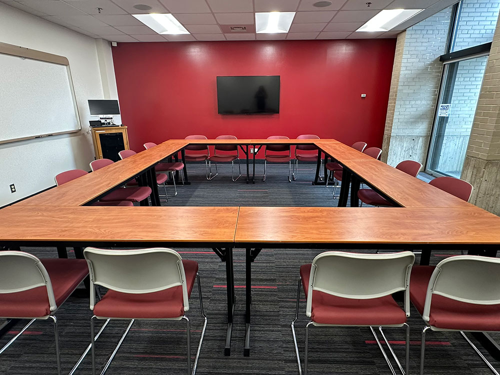 Primrose Room at Atwood Memorial Center from a different angle showing tables, chairs, and a simple meeting setup