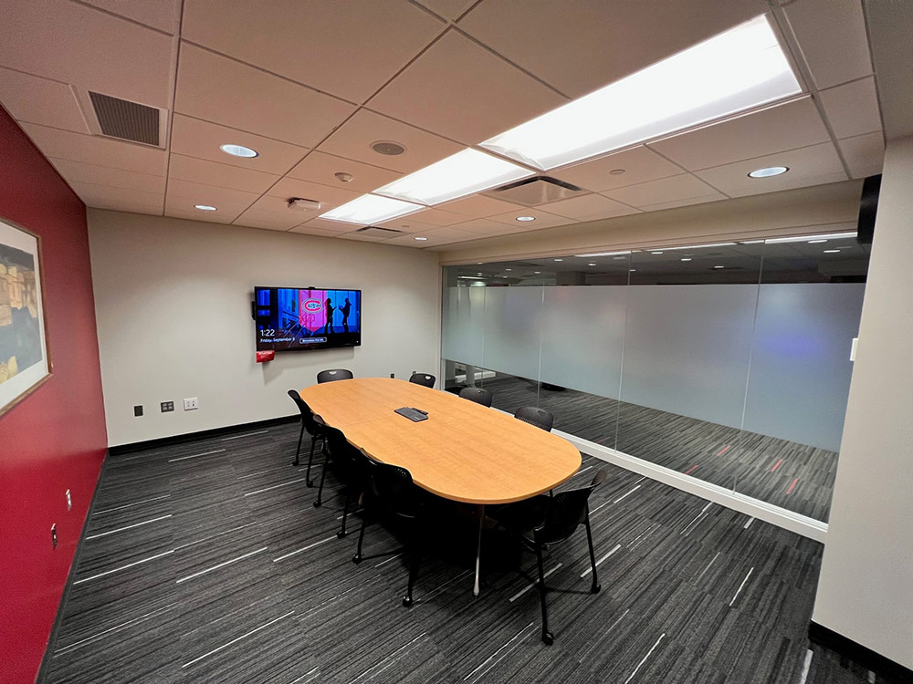 View inside the Union Room in Atwood Memorial Center featuring the table and chairs positioned for a small group discussion with floor‑to‑ceiling windows along one side